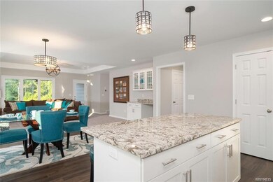 Kitchen island view to great room