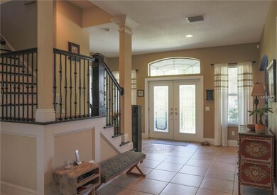Foyer with travertine tile throughout