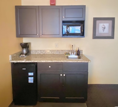 Indoor wet bar with black microwave
