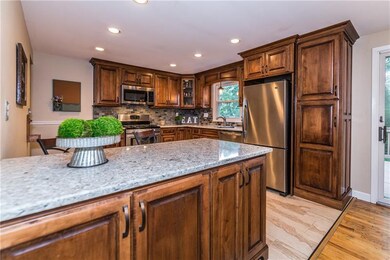 Enjoy morning coffee as the breakfast bar, kitchen