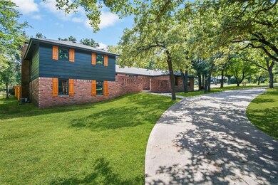 View of side of property featuring a lawn and cent