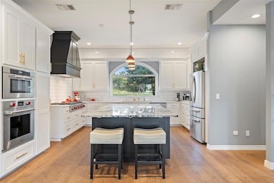 Kitchen featuring appliances with stainless steel