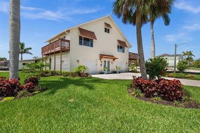 Lush tropical landscaping surrounds the property