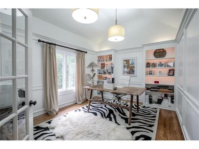 Office off of living room with French doors.