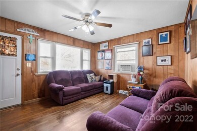Front door leading into the den area. Wall unit a/c is in this room.