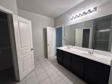 This photo shows a bright bathroom featuring a dou