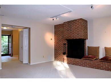 Living Room with Fireplace and Wet Bar at left and