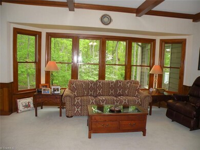 Large Windows in Den overlook Backyard