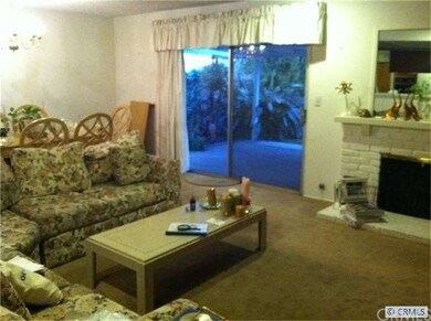 Living room with a Fireplace, next to Formal Dinin