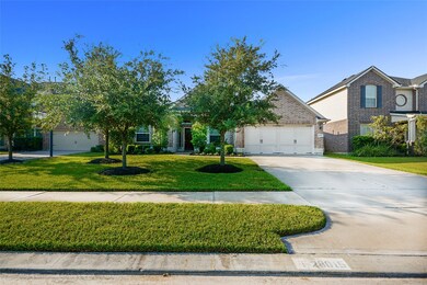 Welcome home!! Gorgeous David Weekley home with beautiful stone and brick elevation with lush landscaping and stone surround draws you in to take a closer look!