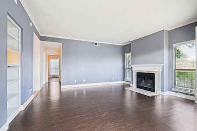 Unfurnished living room with wood finished floors