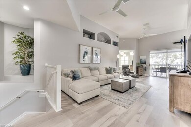Living room featuring light wood-type flooring and ceiling fan