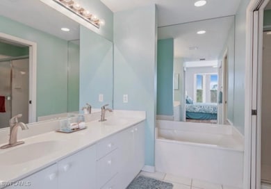 Primary Full bath featuring tile patterned floors,