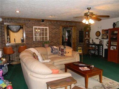 Family Room. Large family room perfect for family game night or watching a big game.  The kitchen has a pass through window and area for bar stools.