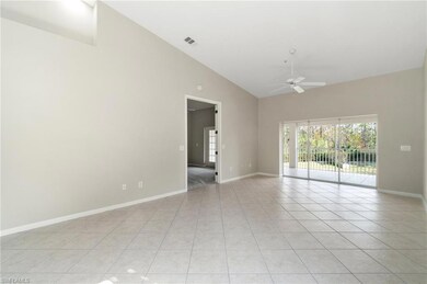 Living area featuring high vaulted ceiling, light 