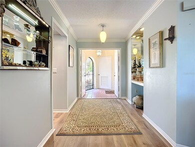 Double entry doors open to this beautiful villa with vinyl plank flooring throughout. The white door in the entry leads to the storage room.