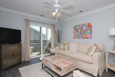 Living room with ceiling fan, visible vents, ornam