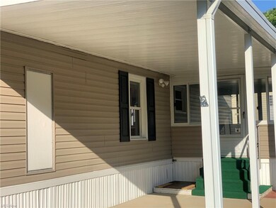 View of side of home and carport.
