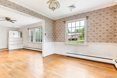 Dining room with hardwood floors.  Looking into li
