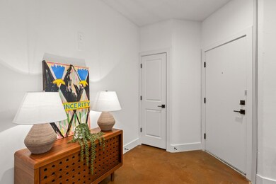 Corridor featuring concrete flooring