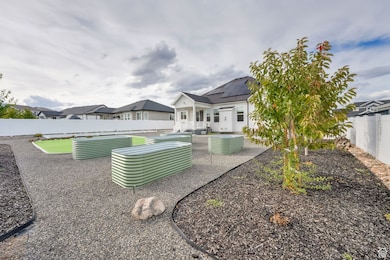 Fenced backyard with a patio