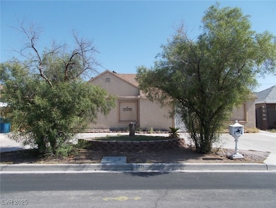 View of property hidden behind natural elements fe