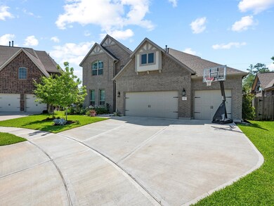 Home features an oversized driveway for plenty of parking or play area.