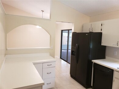 View of kitchen leading into dining area