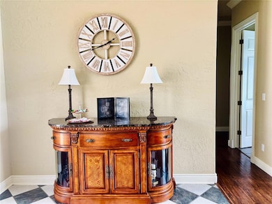 Detailed view of baseboards and wood finished floors