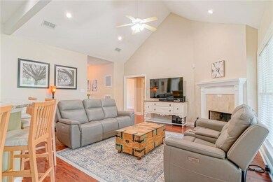 Living room with vaulted ceilings, fireplace, wind