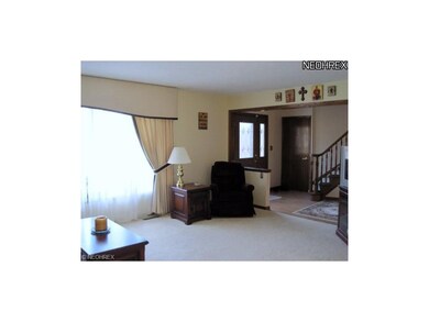 Large windows fill the rooms with natural sunlight.