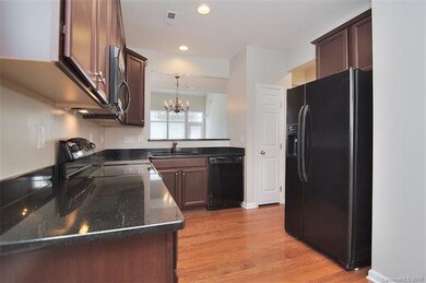 Granite Countertops, Hardwoods, and a pantry make 