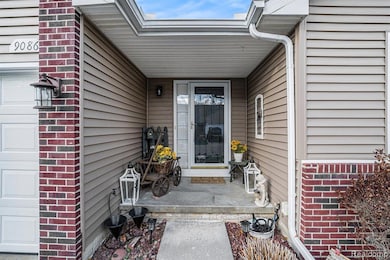 View of exterior entry featuring a garage