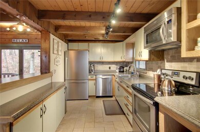 Rustic kitchen with modern touches.  Stainless ste