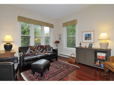 The large living room features windows to the Sout