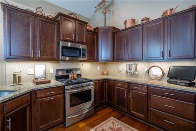 Designer cook's kitchen featuring stainless steel appliances including Kosher refrigerator & granite counter tops!