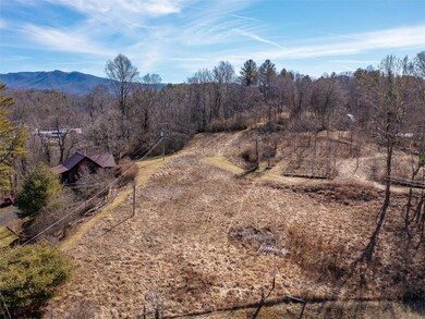 Cleared lower lot with electricity and access to town sewer and water.