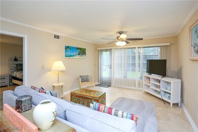 Living room featuring light tile patterned floors,