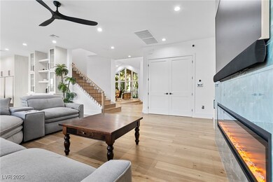 Living room with light wood-type flooring, ceiling