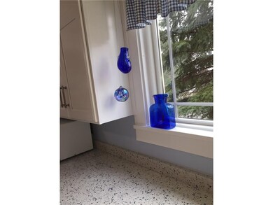 A great view of the kitchen window, countertop and