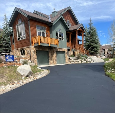 View of front of house featuring stone siding, asp