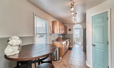 Kitchen has ceramic tile floor, breakfast room & a