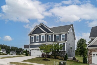 Hardiplank and stone exterior