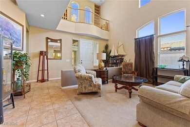 Living room with light tile patterned floors, base