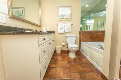 Full bath with a garden tub, toilet, vanity, recessed lighting, and baseboards