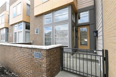 Entrance.  Notice front courtyard patio.  One of two outdoor areas.