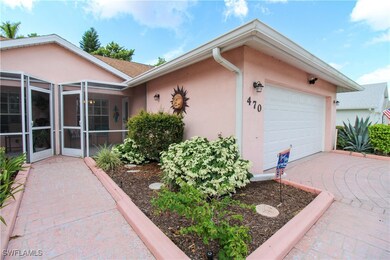 View of property exterior featuring a garage