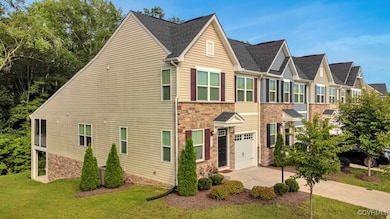 Traditional-style home with stone siding, driveway