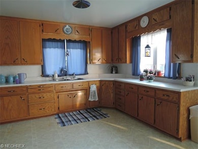 Lots of counters in this country kitchen.