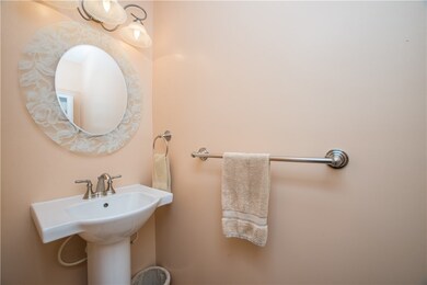 Half bath located on first floor near front door a